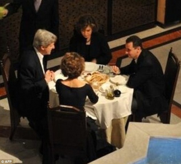 Cosy: This astonishing photograph shows the U.S. Secretary of State John Kerry and his wife having an intimate dinner with Syrian dictator Bashar al-Assad and his wife in 2009