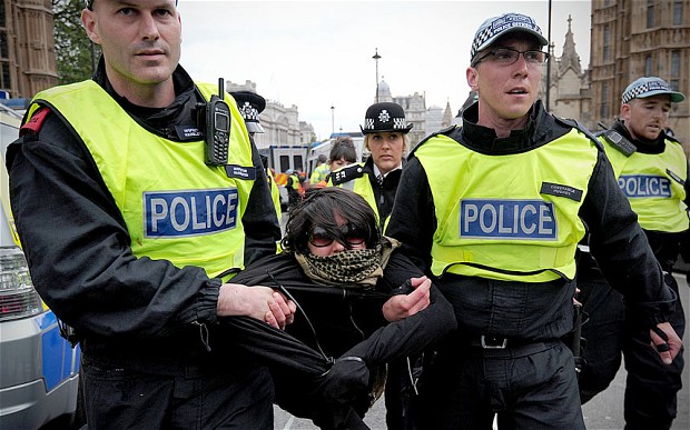 Police detain a UAF protester outside the Houses of Parliament last weekend. 