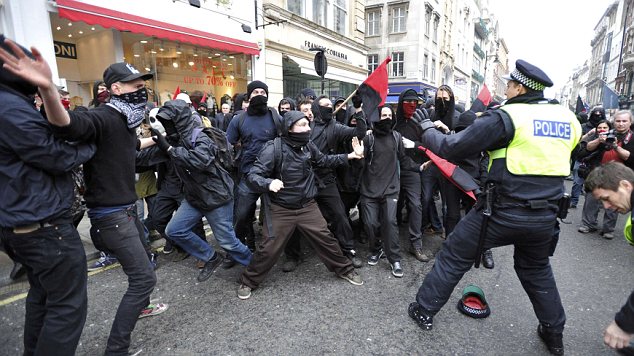 Officers clashing with demonstrators in Oxford Street