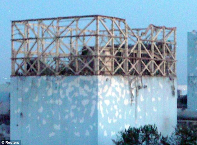 Damaged: The roof of reactor number one at the Fukushima plant after an explosion that blew off the upper part of the structure