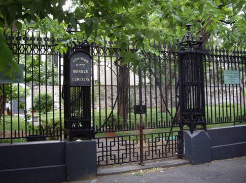 Six to eight blocks of the plastic, military-grade explosive, formally known as Composition 4, were found in a black plastic garbage bag just inside Marble Cemetery, on E. Second St.