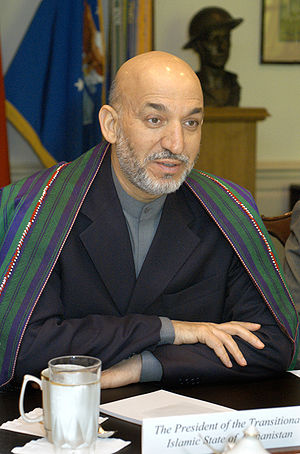 Afghan President Hamid Karzai meets with Secre...