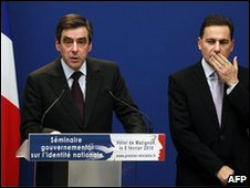 Francois Fillon (left) gives a press conference, next to Eric Besson in Paris, 8 February 2010