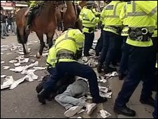 Police and protestors in Manchester city centre