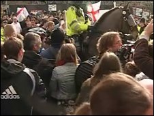 Police and protestors in Manchester city centre