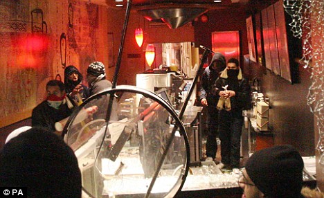 Demonstrators inside the Starbucks branch near the Israeli embassy in London